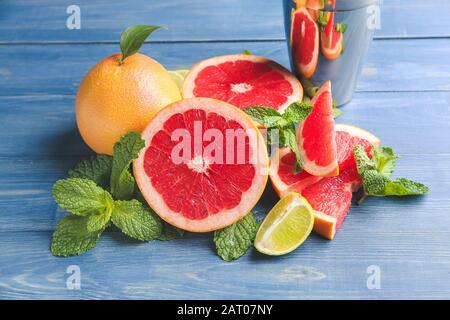 Fresh grapefruits and lime on table Stock Photo