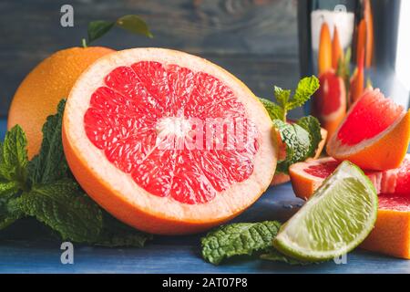Fresh grapefruits and lime on table Stock Photo