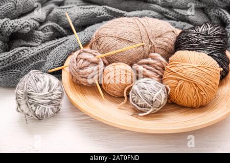 Knitting yarns and needles on table Stock Photo