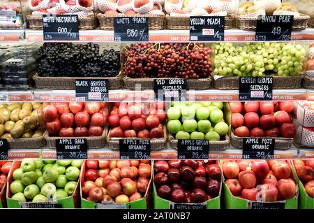 A variety of fresh healthy ripe raw fruits, apples, seedless grapes, nectarines, peaches and snow pear in Bangkok, Thailand Stock Photo