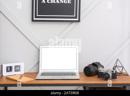 Stylish workplace of modern photographer with laptop Stock Photo