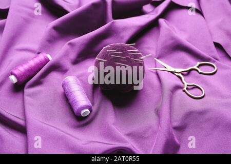 Set of tailor's supplies on fabric Stock Photo
