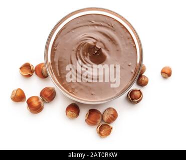 Tasty chocolate paste with hazelnuts on white background Stock Photo