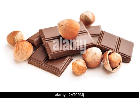 Tasty chocolate with hazelnuts on white background Stock Photo