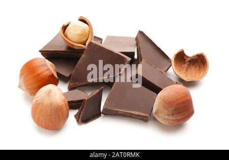 Tasty chocolate with hazelnuts on white background Stock Photo