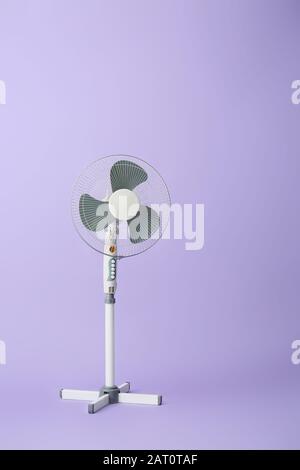 Electric fan on color background Stock Photo