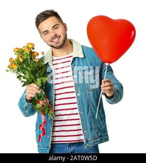 Handsome man with heart-shaped balloon and flowers on white background. Valentine's Day celebration Stock Photo
