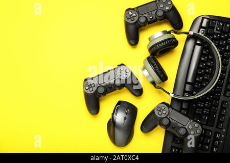 https://l450v.alamy.com/450v/2at0xc4/modern-gaming-accessories-on-color-background-2at0xc4.jpg