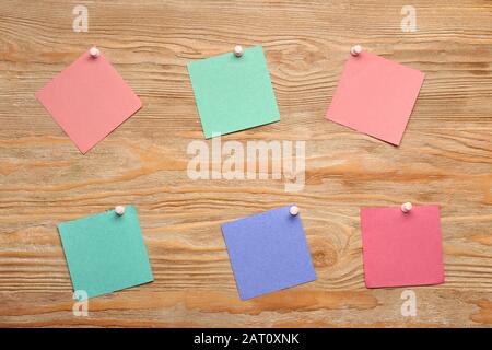 Sticky notes on wooden background Stock Photo