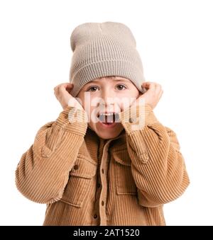 Little boy in winter clothes on white background