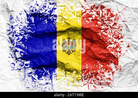 The national flag of the Moldova  is painted on crumpled paper. Flag printed on the sheet. Flag image for design on flyers, advertising. Stock Photo