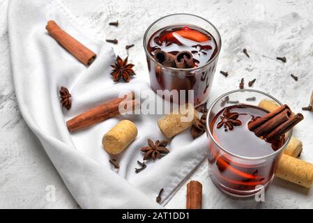 Glasses of tasty mulled wine on table Stock Photo