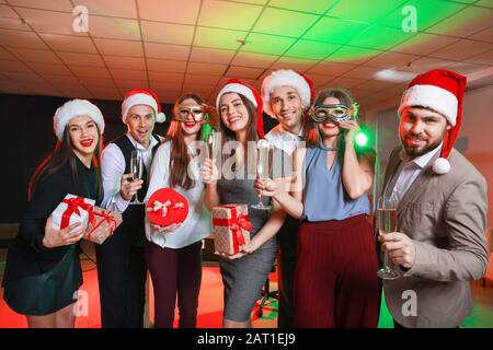 Colleagues at New Year party in office Stock Photo