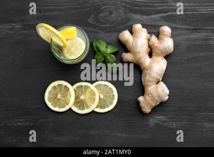 Composition with tasty ginger lemonade on wooden background Stock Photo