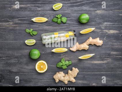 Composition with tasty ginger lemonade on wooden background Stock Photo
