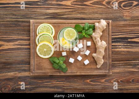 Composition with tasty ginger lemonade on wooden background Stock Photo