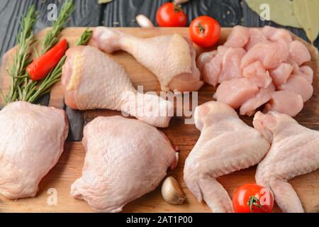 Raw chicken meat and vegetables on table Stock Photo