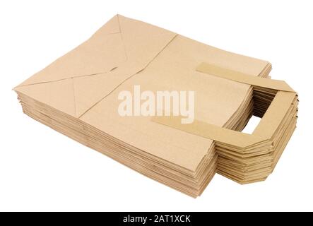 Group of flat unfolded plain brown paper take away food carrier bags with handles isolated on a white background Stock Photo
