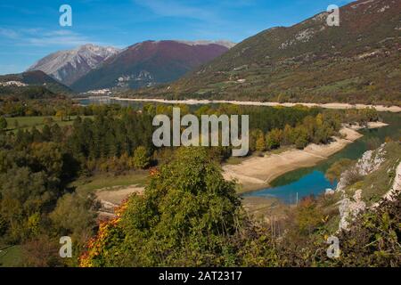 View of Barrea Lake, surrounded by the uncontaminated tops of the Apennines. Three adorable villages are reflected in its water: Barrea, Villetta Barr Stock Photo