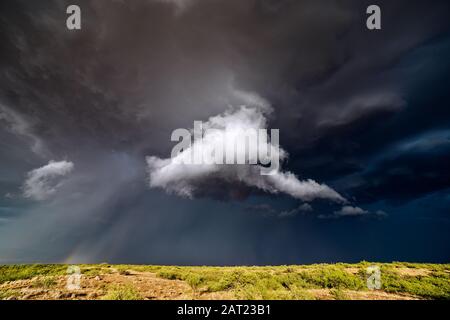 Scenic landscape with ominous, dark storm clouds in the sky from a thunderstorm Benson, Arizona Stock Photo