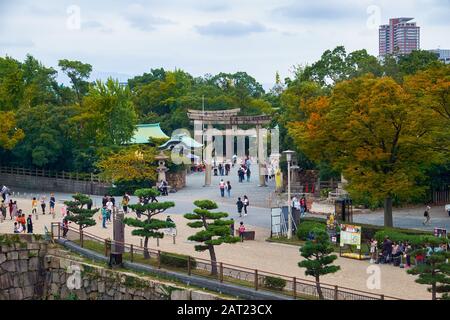 OSAKA, JAPAN - OCTOBER 14, 2019:   The main torii gate at the entrance to the territory of Hokoku Shrine in the Osaka Castle. Osaka. Japan Stock Photo