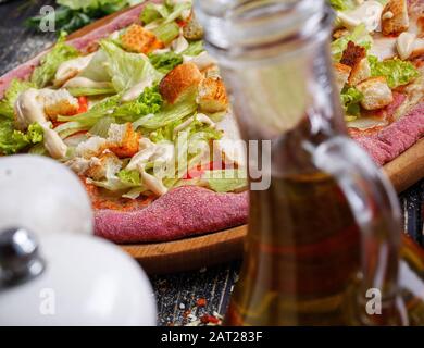 Vegetarian Pizza. Pizza With leaves of cabbage and crackers. not traditional cuisine. Stock Photo