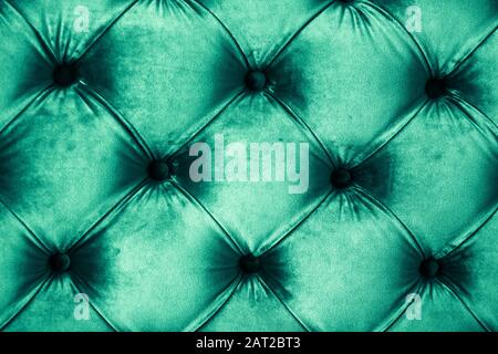 Furniture design, classic interior and royal vintage material concept - Emerald luxury velour quilted sofa upholstery with buttons, elegant green home Stock Photo