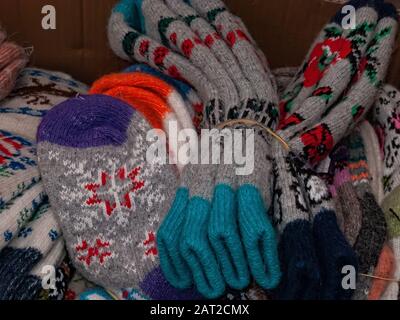A pile of warm wool socks. winter comfort, winter inspiration, still life. A stack of knitted wool colorful socks Stock Photo
