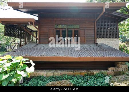 Exterior Lanna design and building architecture of coffee cafe and bakery pastry shop built with northern Thai traditional wooden house- Thailand Stock Photo