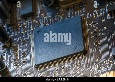 Electronic circuit board close up. Electronic computer hardware technology. PC microchip. Integrated semiconductor microprocessor Stock Photo