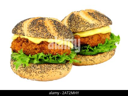 Breadcrumb covered salmon fish cake sandwich rolls isolated on a white background Stock Photo