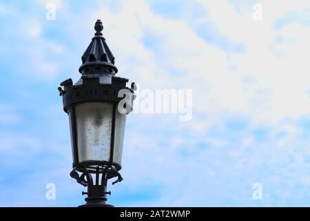 closeup of a duty old lampost during daytime against a blue sky in Fisherman's Bastion, Hungary Stock Photo