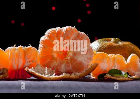 oranges tangerine,citrus reticula.on table with black background and back light still life .mandarin variety orange contains pomelo and c vitamin. Stock Photo