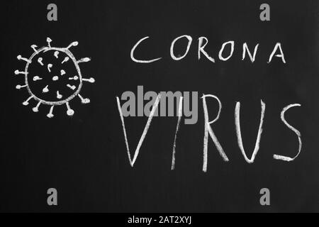 Corona virus hand-drawn text and simple illustration with chalk on blackboard Stock Photo