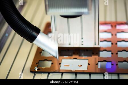 CNC lathe machine cooled by water during machining Stock Photo