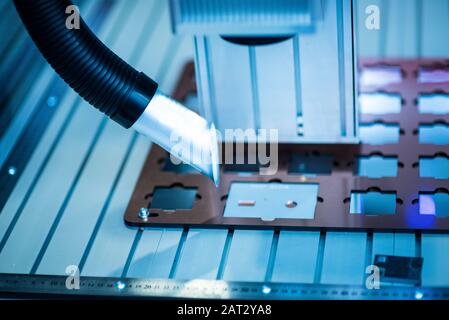 CNC lathe machine cooled by water during machining Stock Photo