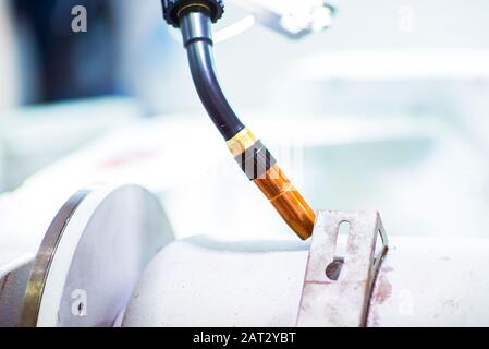 Automatic robotic arm for metal welding operations Stock Photo