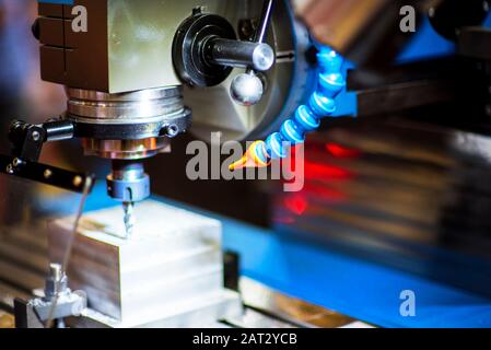 CNC lathe machine cooled by water during machining Stock Photo