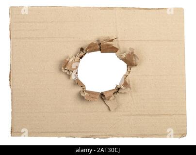 Ripped hole in cardboard package. Isolated on white with clipping path Stock Photo