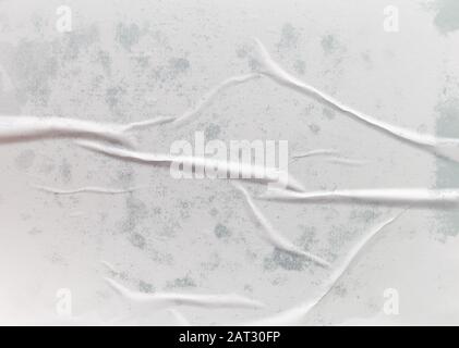 Wet crumpled glued paper for background or texture Stock Photo