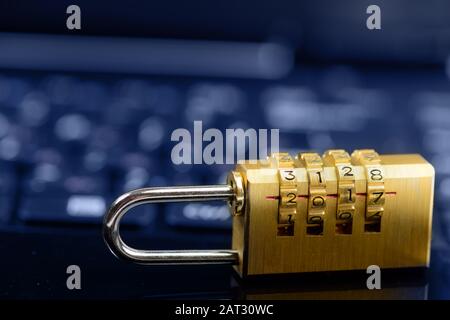 Cyber safety or security encryption concept, code numbers pad lock on laptop computer Stock Photo