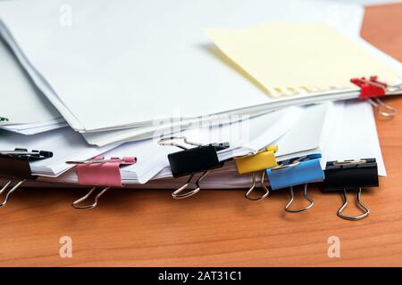 Pile of documents on office desk Stock Photo