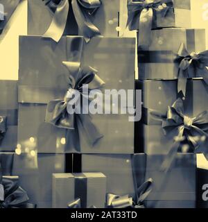 Gift boxes stand on top of each other. Toned. Close up. Stock Photo