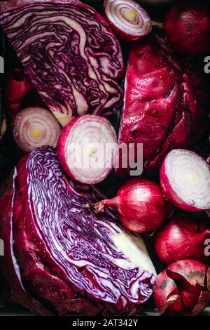 Red cabbage and onions close up. Cut purple vegetables under preparation Stock Photo