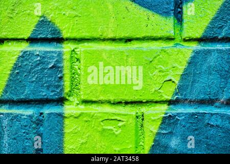 Brick wall with abstract pattern of turquoise and green color. Background. Texture. Stock Photo