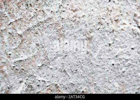 White and rough wall of plaster. Background. Texture. Stock Photo