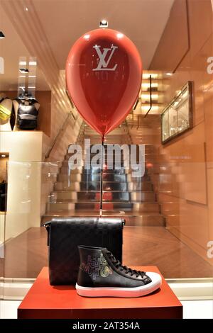 Louis Vuitton bag displayed in window showcase Stock Photo - Alamy