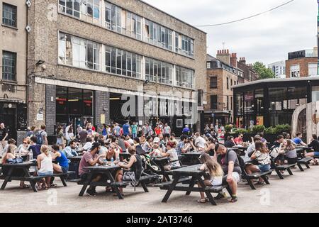 Young People resting in Dray Walk outside Sunday Up Market, Old Truman ...