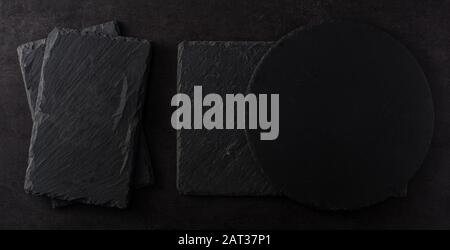 Black slate kitchenware background Stock Photo