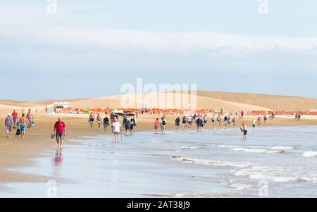 Tourists enjoying the warm weather on the beach a Malpalomas, Gran Canaria, Stock Photo